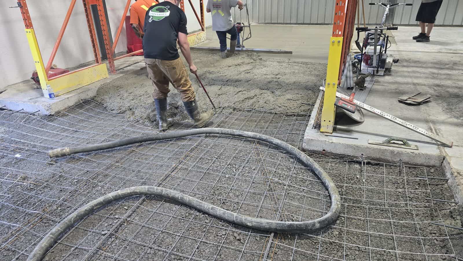 Concrete slab pour over steel mesh reinforcement in a Montreal area warehouse
