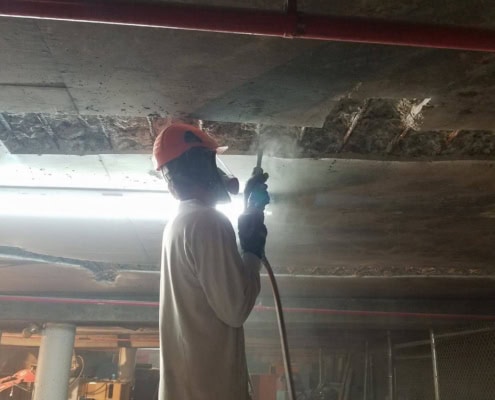 Overhead concrete repair in a Montreal underground parking garage