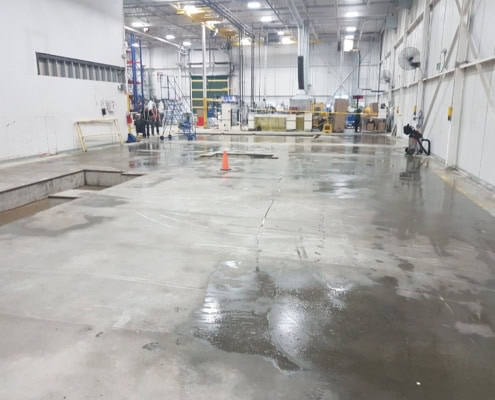 Industrial concrete machine foundation poured in a Montreal warehouse